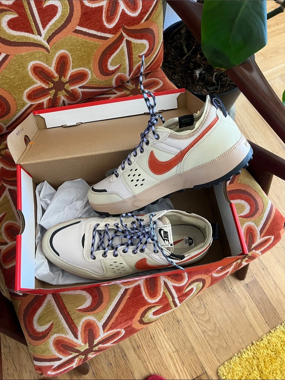Nike Men's Cream Sneakers with Orange Swoosh and Black Accents